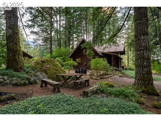 67930 East Stage Stop Road Welches, OR 97067 - Photo 43 of 43 a backyard of a house with table and chairs