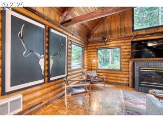 67930 East Stage Stop Road Welches, OR 97067 - Photo 5 of 43 a view of a livingroom with wooden floor and furniture