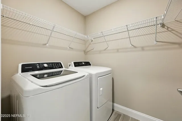 a utility room with dryer and washer