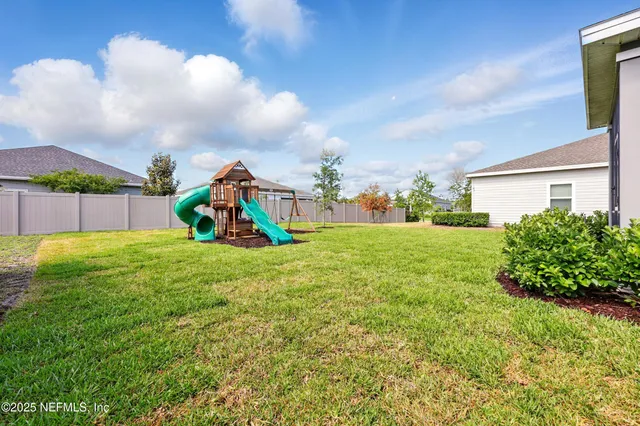 a view of a house with a back yard