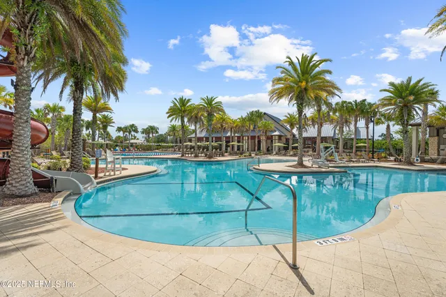 a view of outdoor space with swimming pool and lounge chair