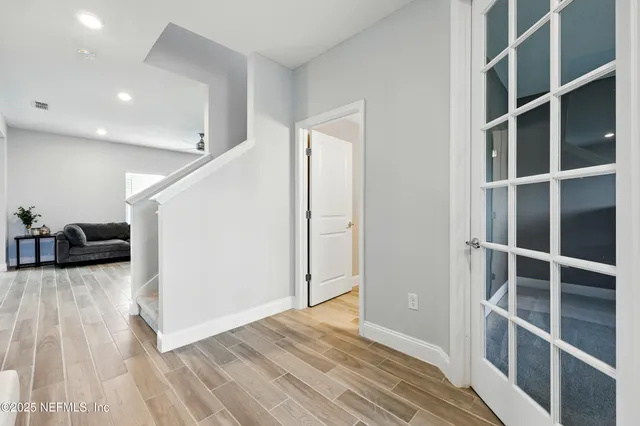 a view of entryway with wooden floor