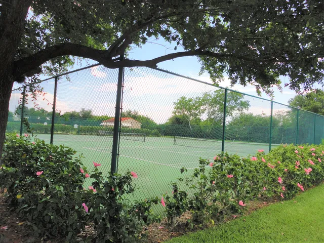 a view of a lake with houses in the back