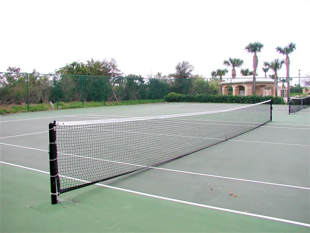 a swimming pool with outdoor seating and yard