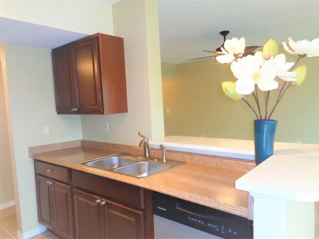 a dining room with wooden floor and a window