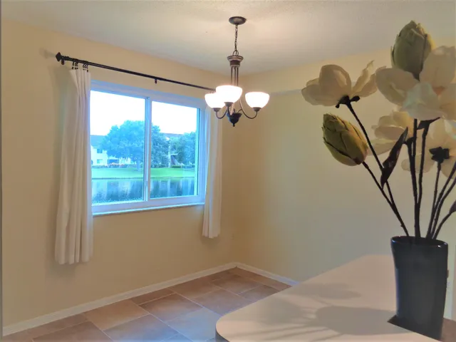 a room with a chandelier furniture and a chandelier