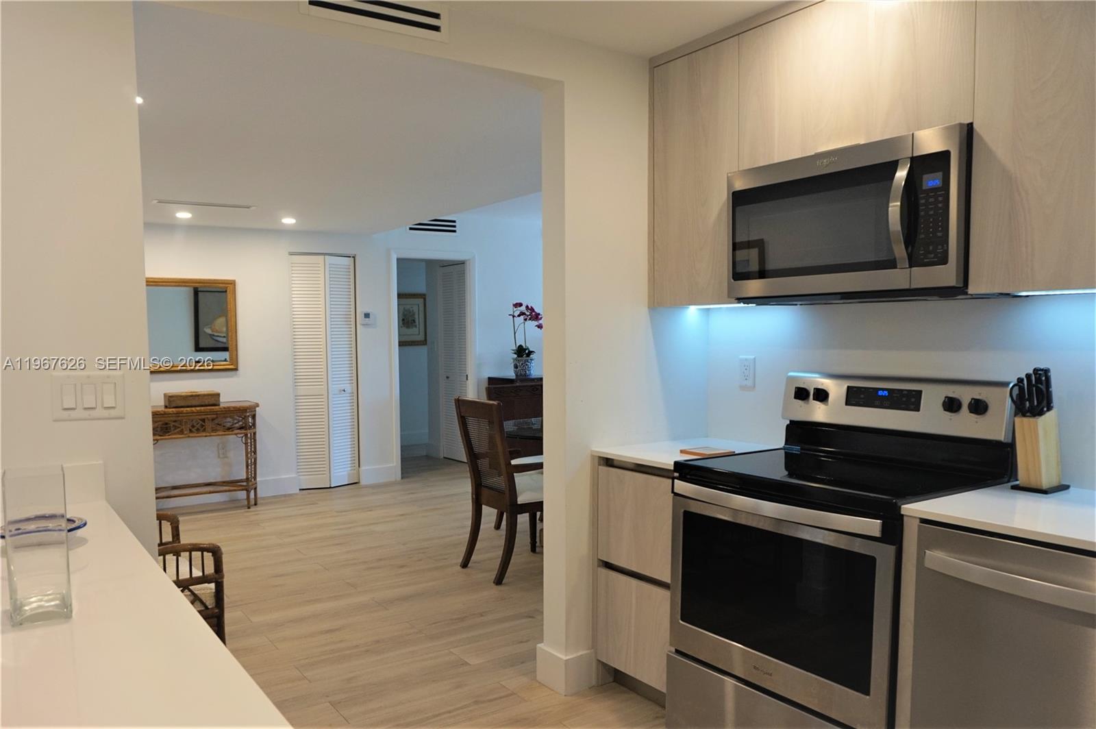 210 Seaview Drive, Unit 408 Key Biscayne, FL 33149 - Photo 11 of 34 a kitchen with a stove and a microwave