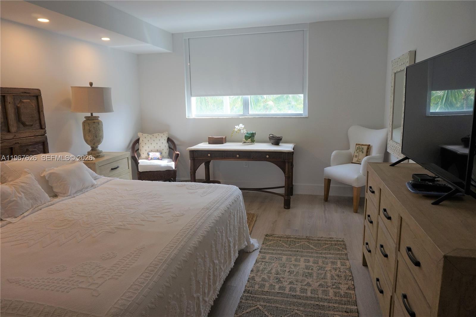 210 Seaview Drive, Unit 408 Key Biscayne, FL 33149 - Photo 15 of 34 a bedroom with two beds and a flat screen tv