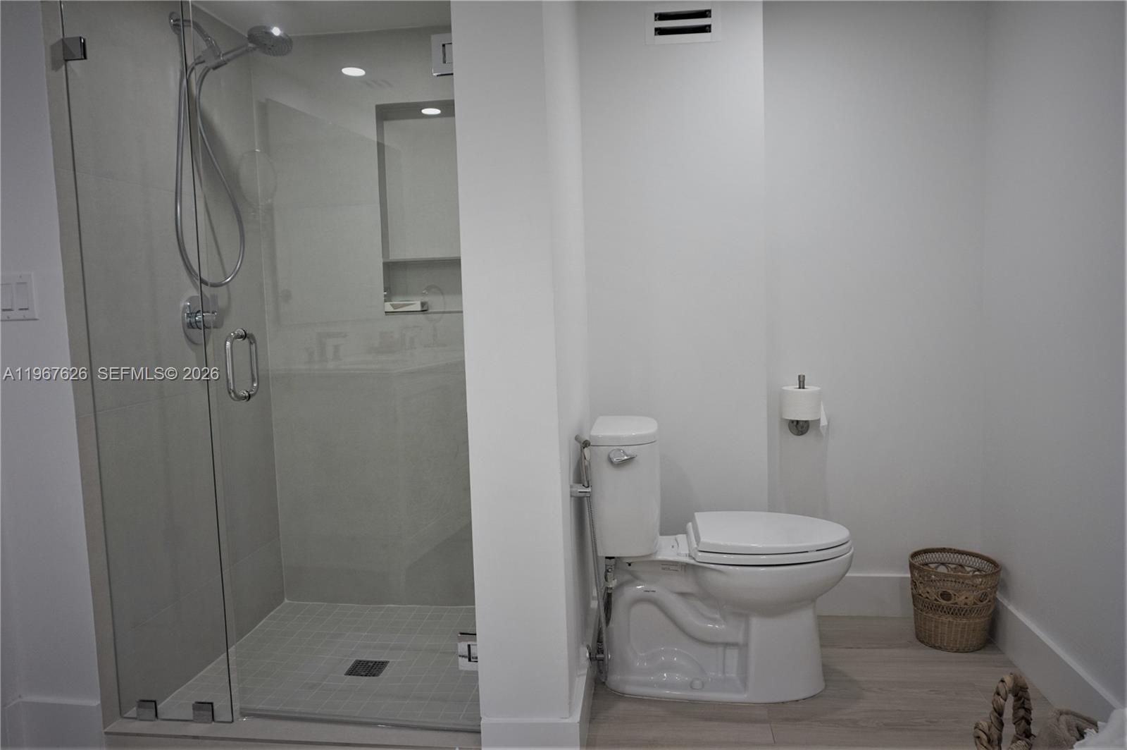 210 Seaview Drive, Unit 408 Key Biscayne, FL 33149 - Photo 18 of 34 a bathroom with a toilet and a shower
