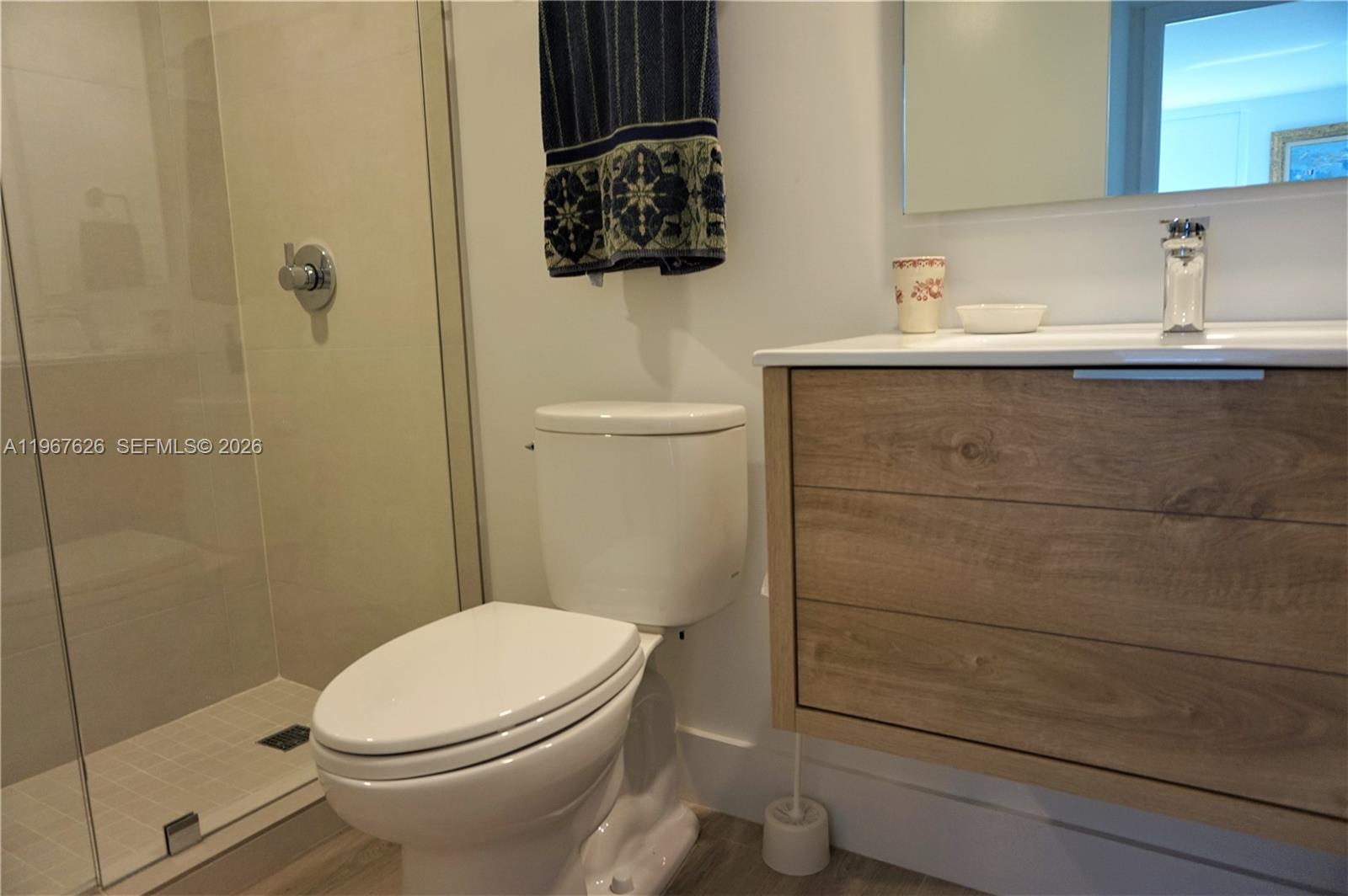 210 Seaview Drive, Unit 408 Key Biscayne, FL 33149 - Photo 24 of 34 a bathroom with a sink a toilet and shower