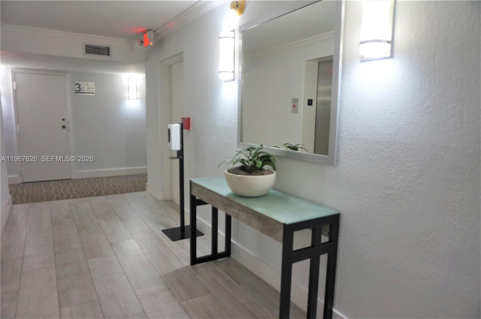 210 Seaview Drive, Unit 408 Key Biscayne, FL 33149 - Photo 25 of 34 a view of hallway with wooden floor
