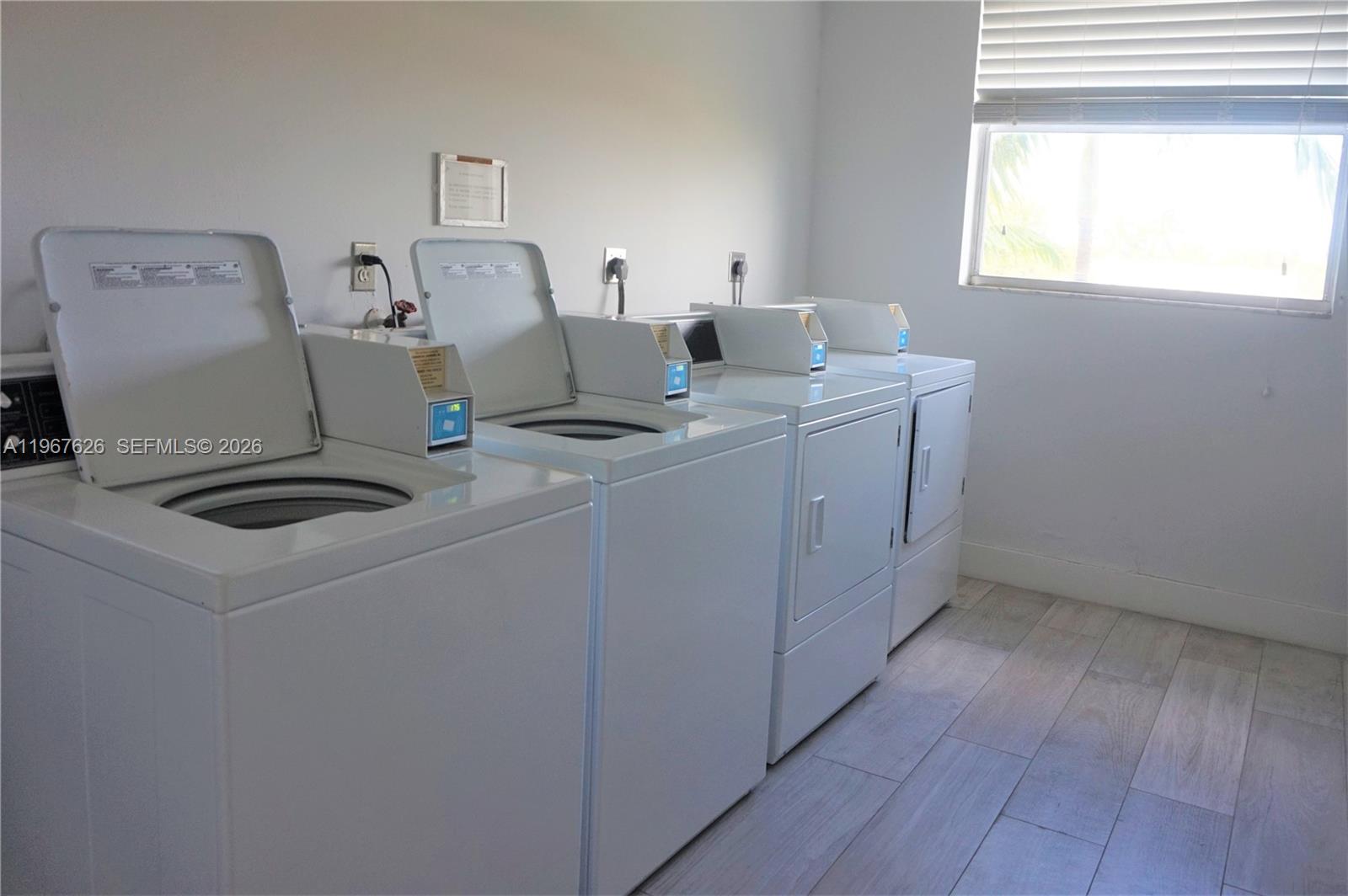 210 Seaview Drive, Unit 408 Key Biscayne, FL 33149 - Photo 26 of 34 a view of storage and utility room with washer and dryer