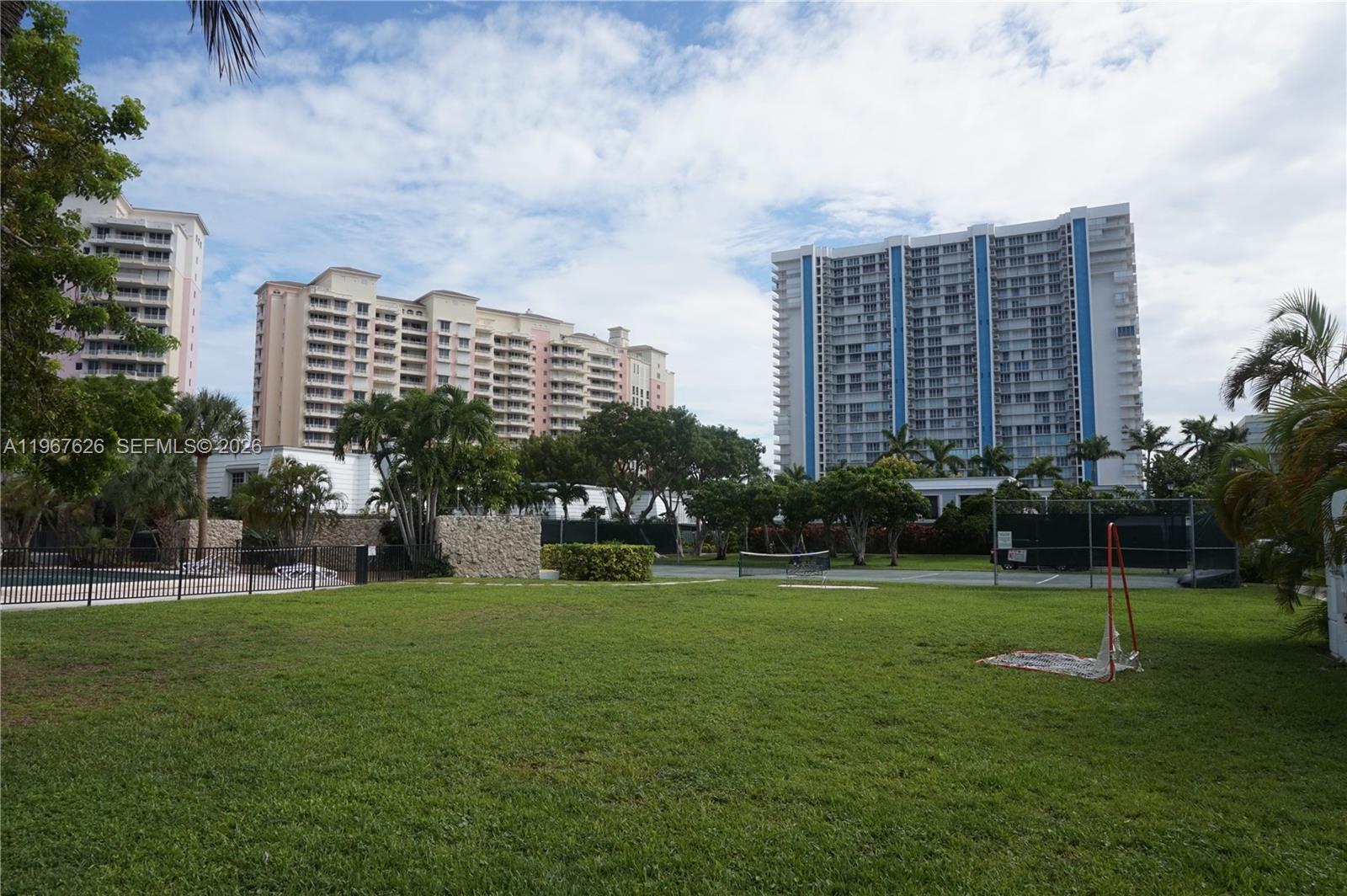 210 Seaview Drive, Unit 408 Key Biscayne, FL 33149 - Photo 27 of 34 a view of building with yard