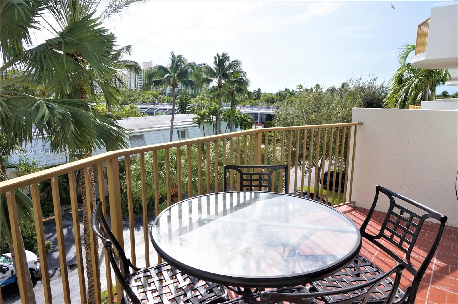 210 Seaview Drive, Unit 408 Key Biscayne, FL 33149 - Photo 3 of 34 a view of a balcony with furniture