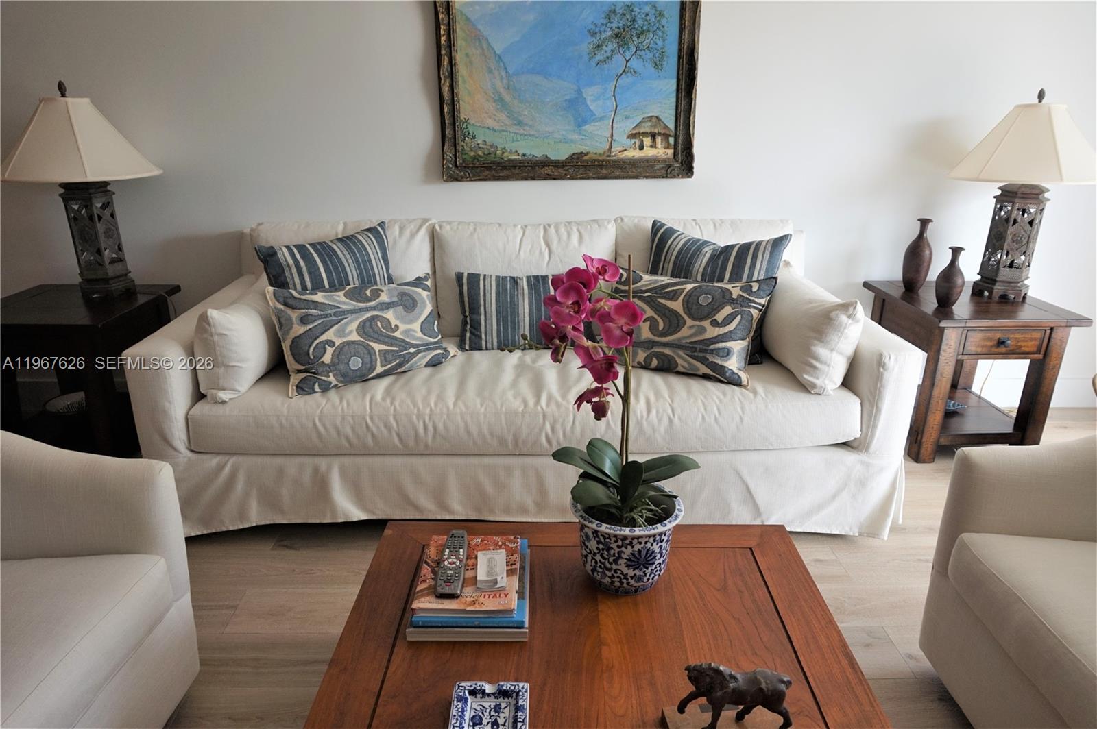 210 Seaview Drive, Unit 408 Key Biscayne, FL 33149 - Photo 4 of 34 a living room with furniture and a lamp