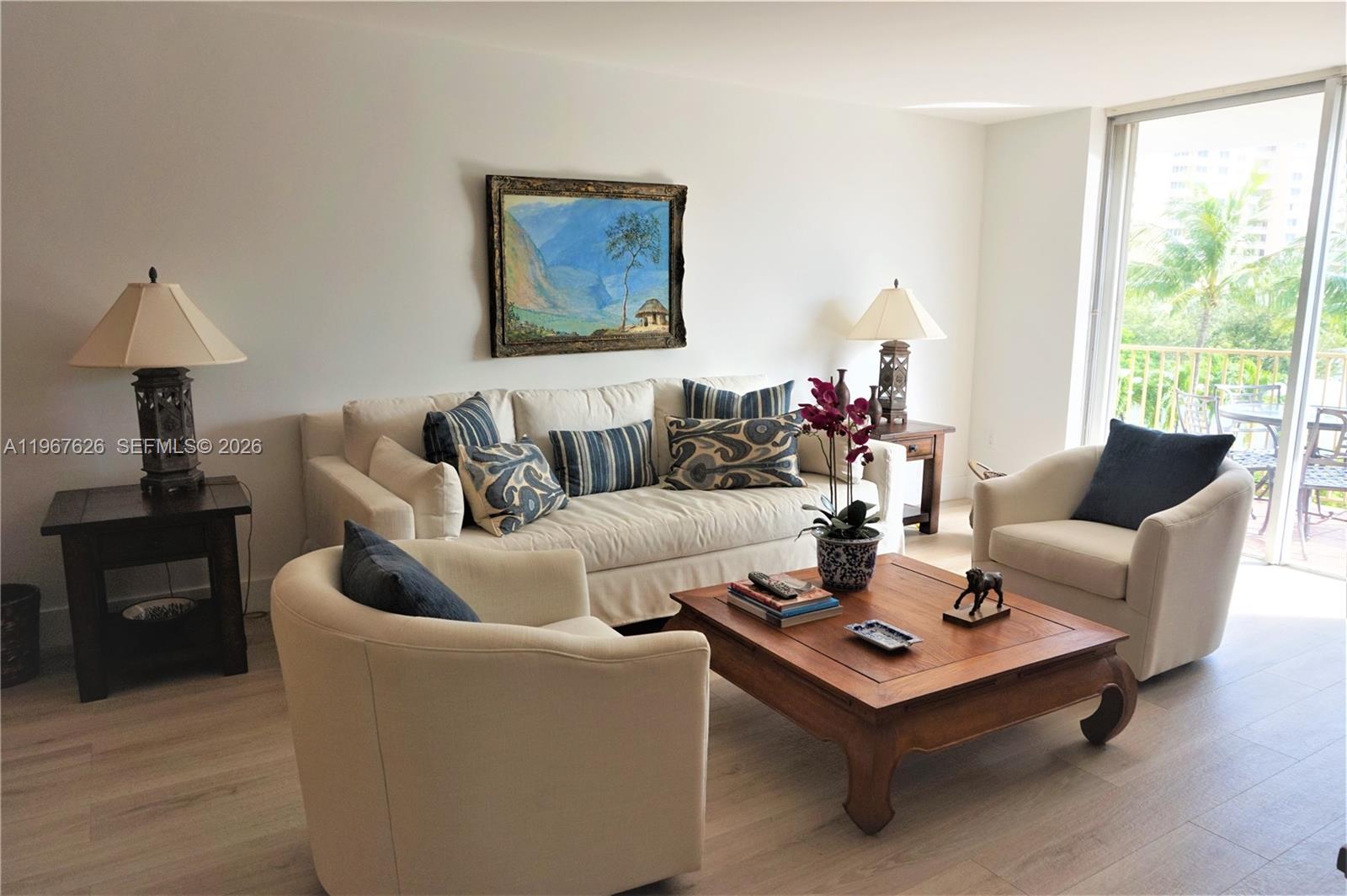210 Seaview Drive, Unit 408 Key Biscayne, FL 33149 - Photo 7 of 34 a living room with furniture and a large window