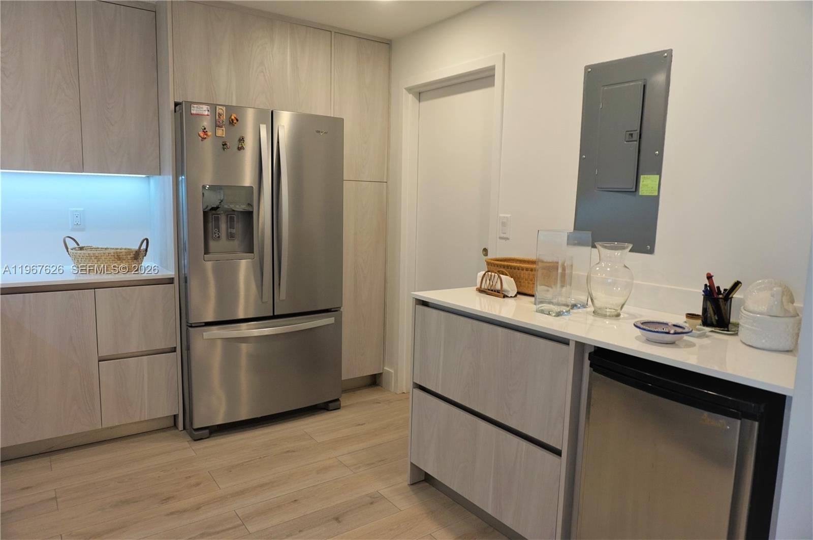 210 Seaview Drive, Unit 408 Key Biscayne, FL 33149 - Photo 10 of 34 a kitchen with appliances a sink and a refrigerator