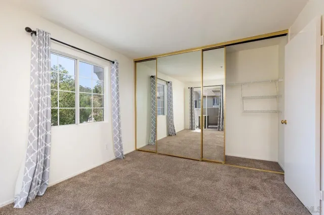 a big room with windows and closet