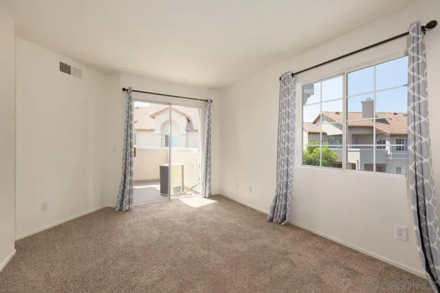 a view of empty room with windows