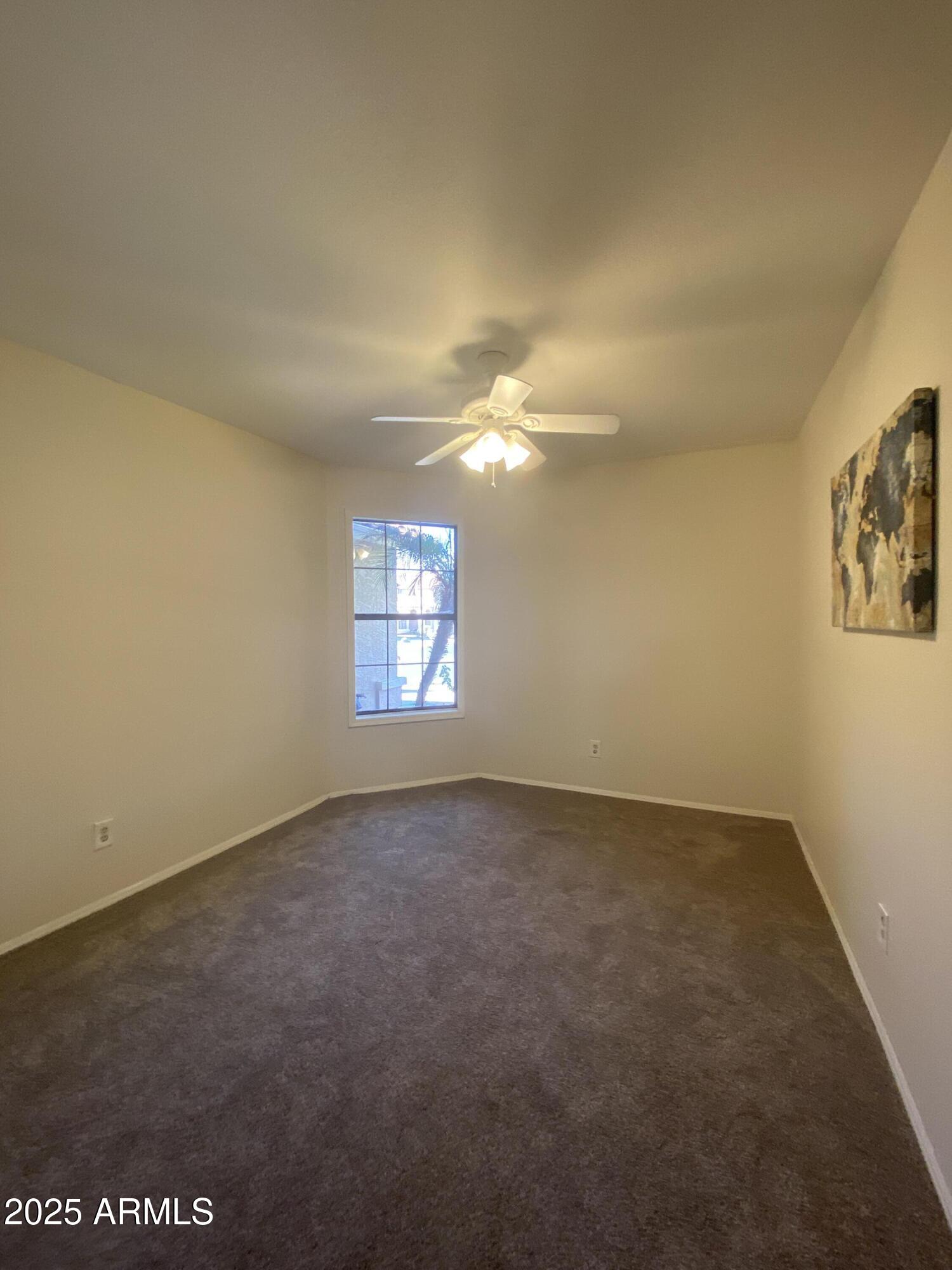 15017 South 25th Way Phoenix, AZ 85048 - Photo 12 of 18 an empty room with a empty space and windows