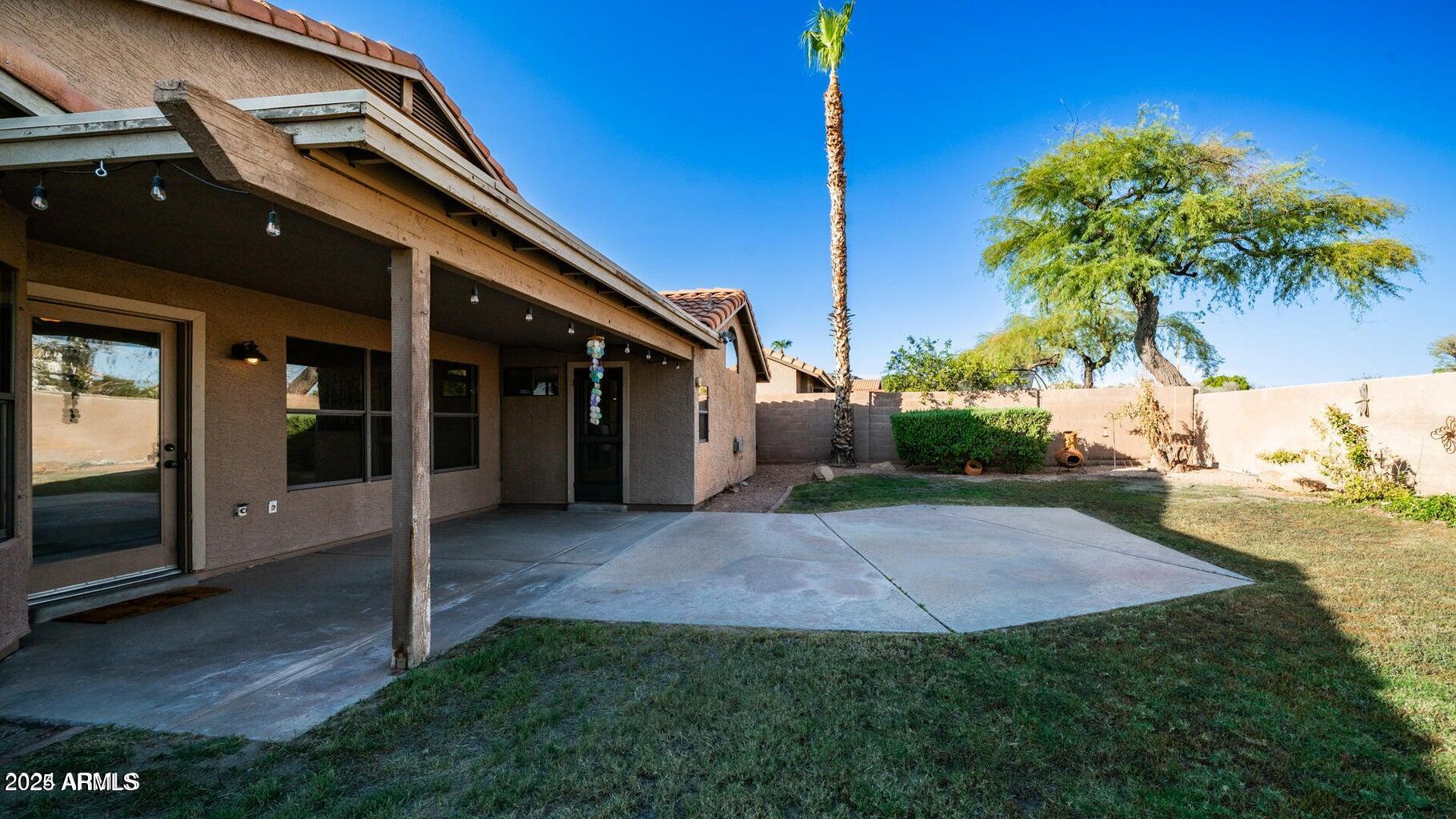 15017 South 25th Way Phoenix, AZ 85048 - Photo 17 of 18 a view of an house with backyard space and garden