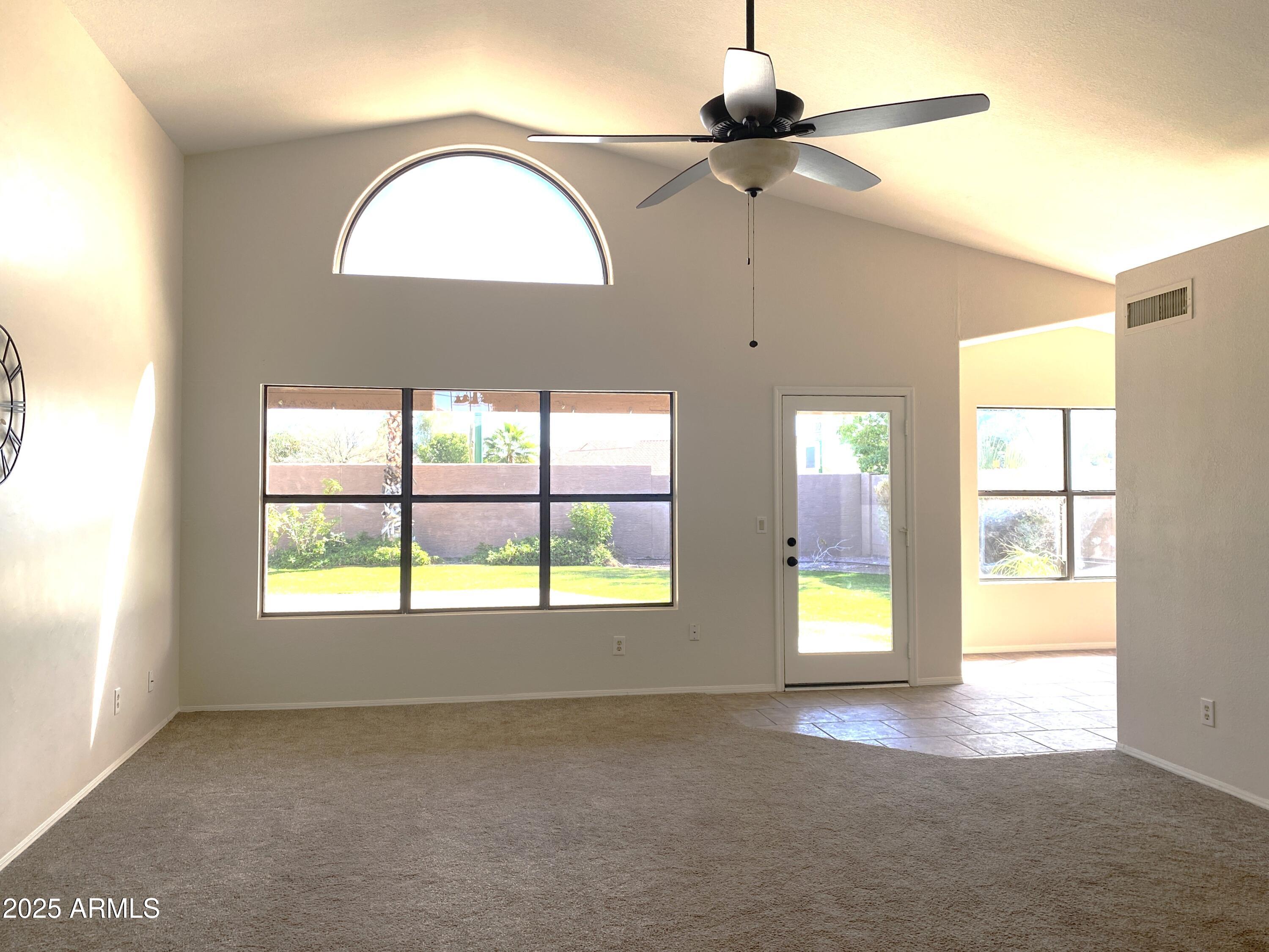 15017 South 25th Way Phoenix, AZ 85048 - Photo 2 of 18 a view of an empty room with a window