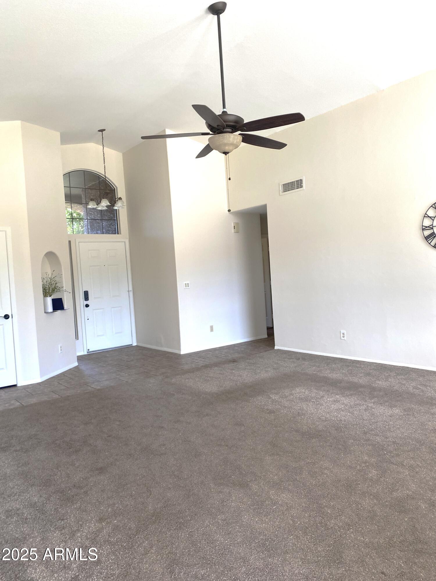 15017 South 25th Way Phoenix, AZ 85048 - Photo 3 of 18 a view of a room with a ceiling fan
