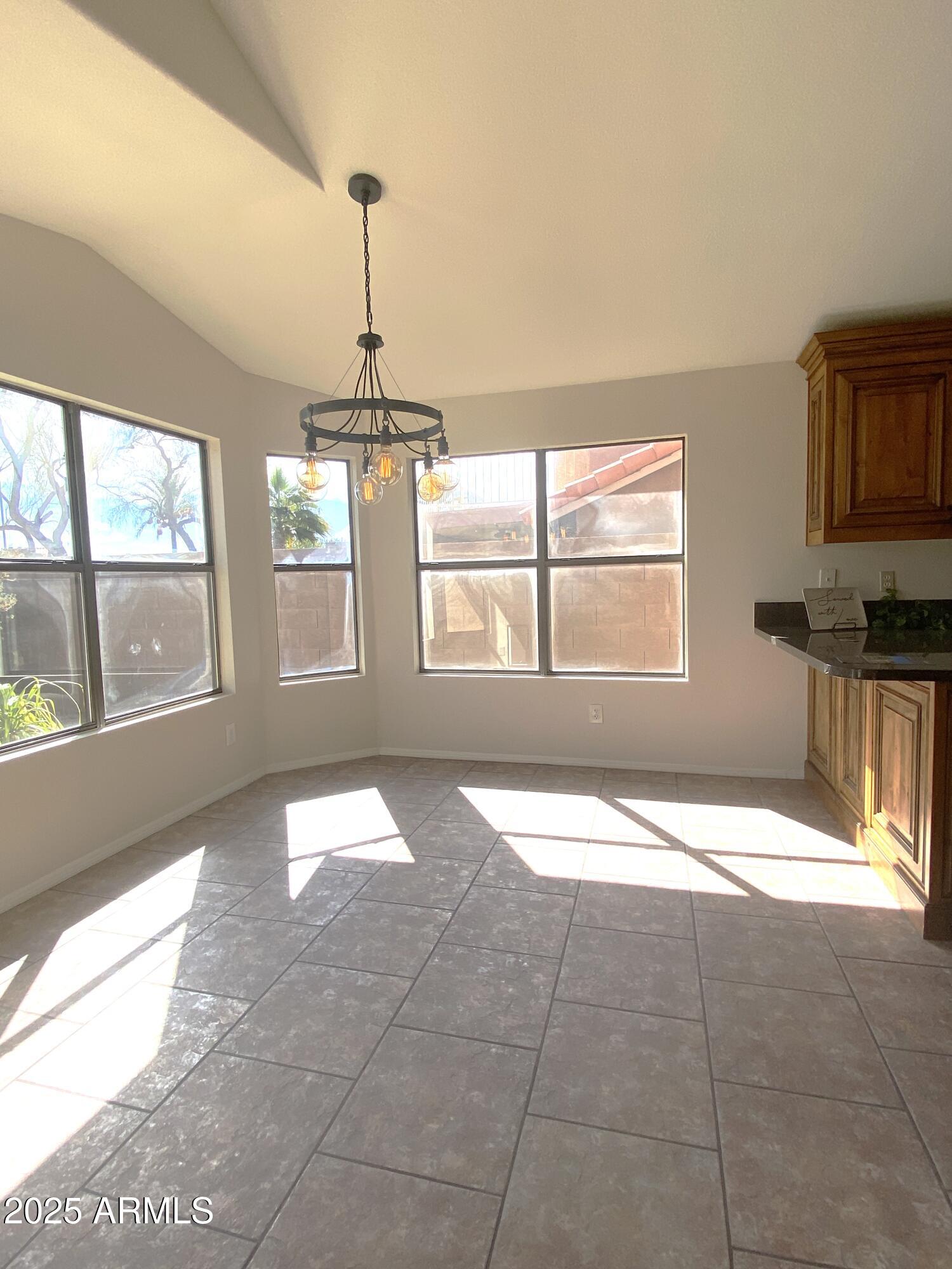 15017 South 25th Way Phoenix, AZ 85048 - Photo 4 of 18 a view of an empty room with a window