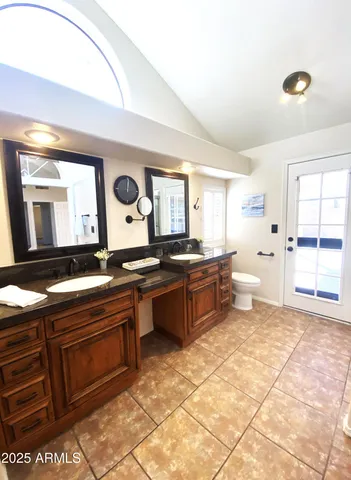 a large bathroom with a large tub and sink