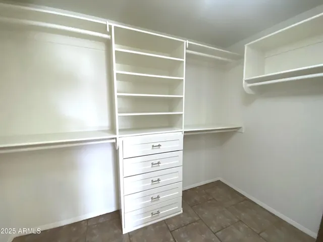 a view of an empty walk in closet