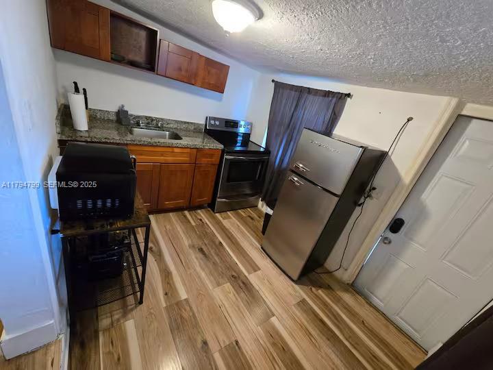 7638 North Miami Avenue, Unit 8 Miami, FL 33150 - Photo 3 of 5 a room with storage and utility