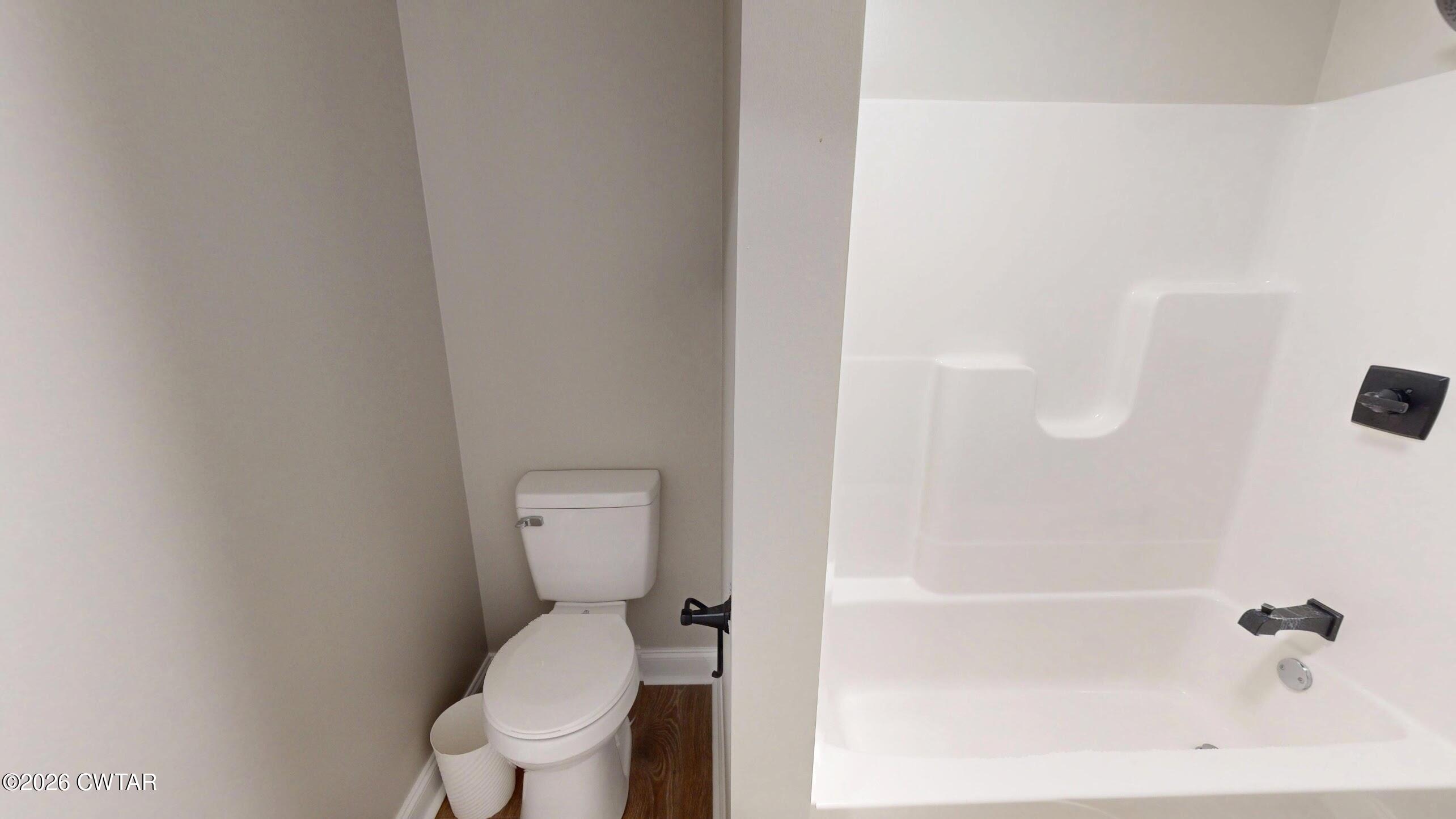 2800 Locust Grove Road Newbern, TN 38059 - Photo 43 of 46 a white toilet sitting next to a bath tub