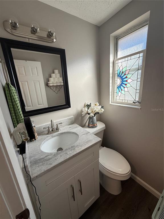 600 Briarwood Road Venice, FL 34293 - Photo 11 of 13 a bathroom with a toilet sink and mirror