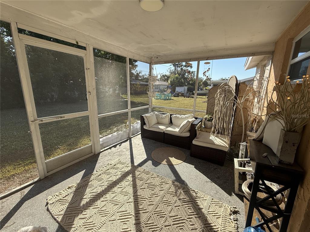 600 Briarwood Road Venice, FL 34293 - Photo 12 of 13 a balcony with furniture and a potted plant