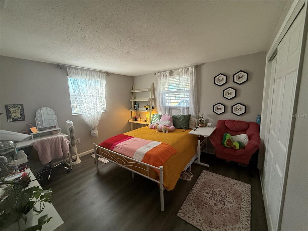 600 Briarwood Road Venice, FL 34293 - Photo 6 of 13 a bedroom with a bed and a window