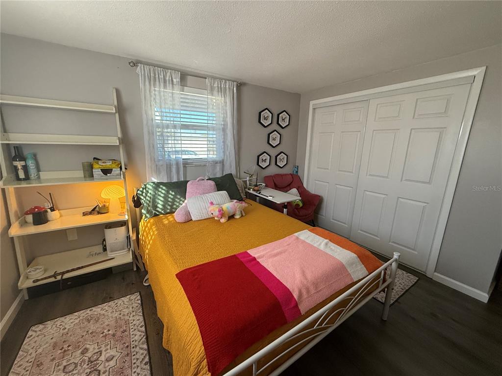 600 Briarwood Road Venice, FL 34293 - Photo 7 of 13 a bed room with a bed and a window