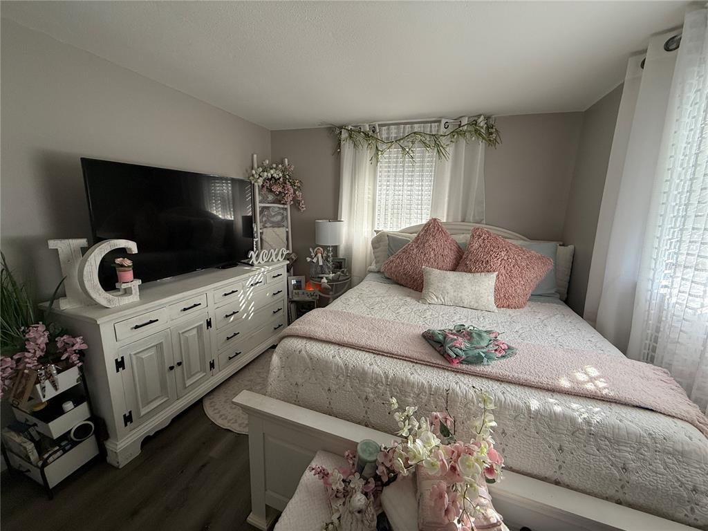 600 Briarwood Road Venice, FL 34293 - Photo 10 of 13 a bedroom with furniture and flat screen tv