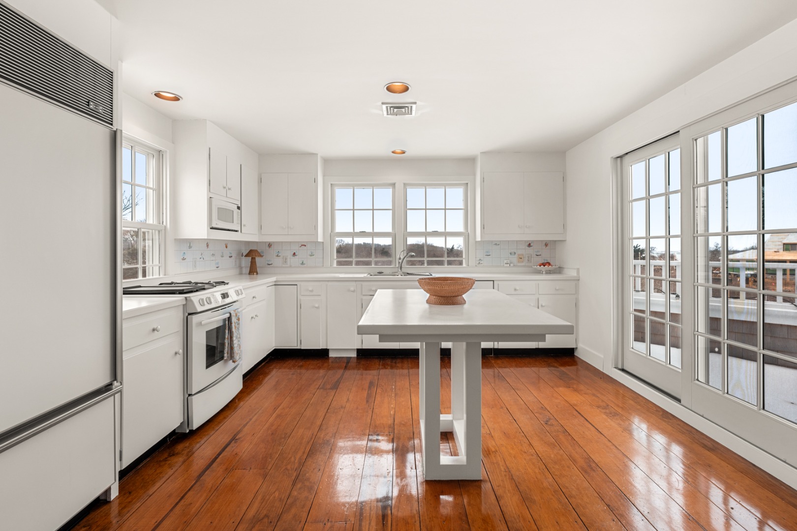 6 Fargo Way Nantucket, MA 02554 - Photo 8 of 28 a kitchen with a sink a window a counter top space and stainless steel appliances