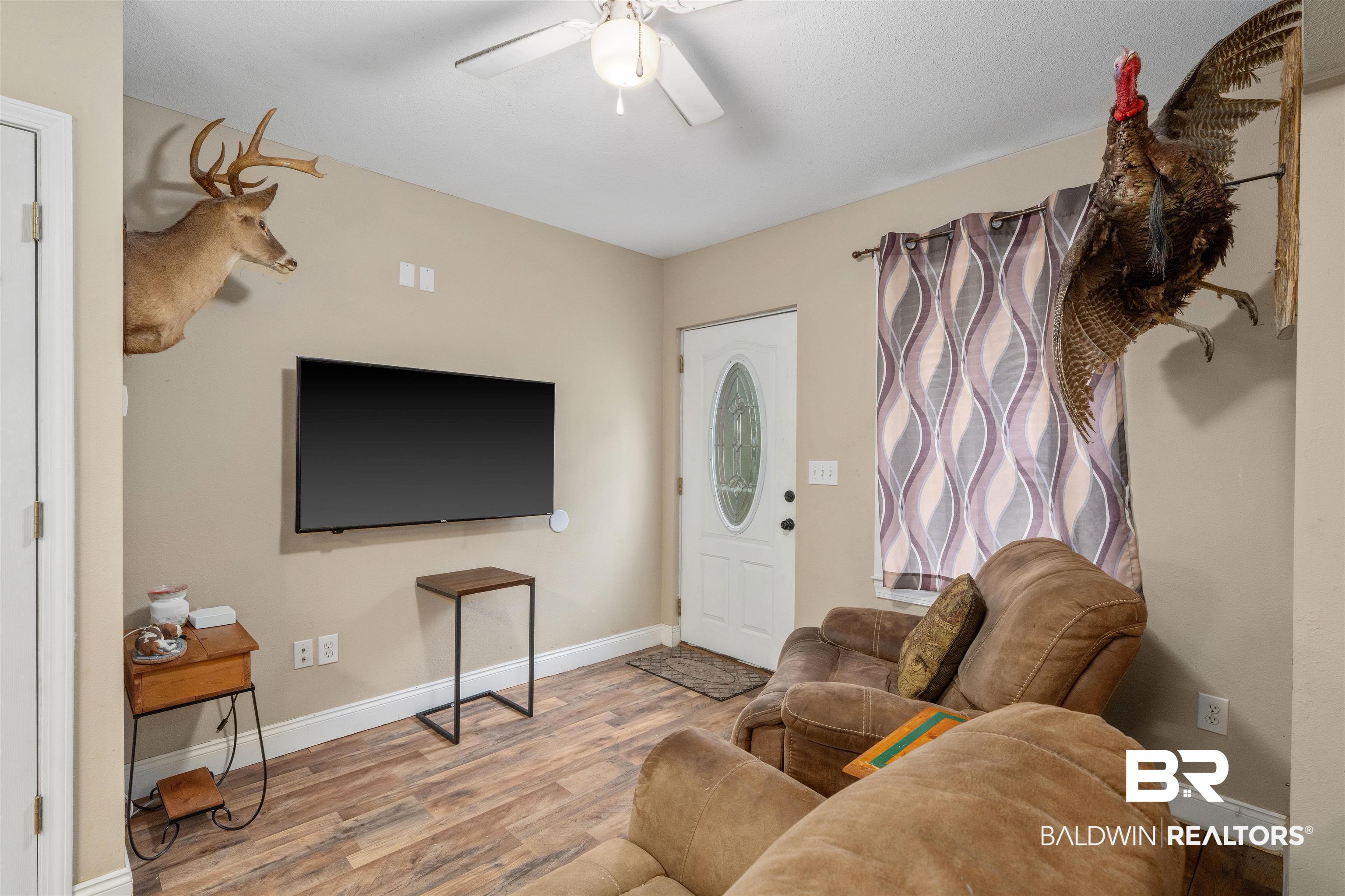 23186 Pecan Street Robertsdale, AL 36567 - Photo 19 of 36 Living area with light wood-style flooring and a ceiling fan