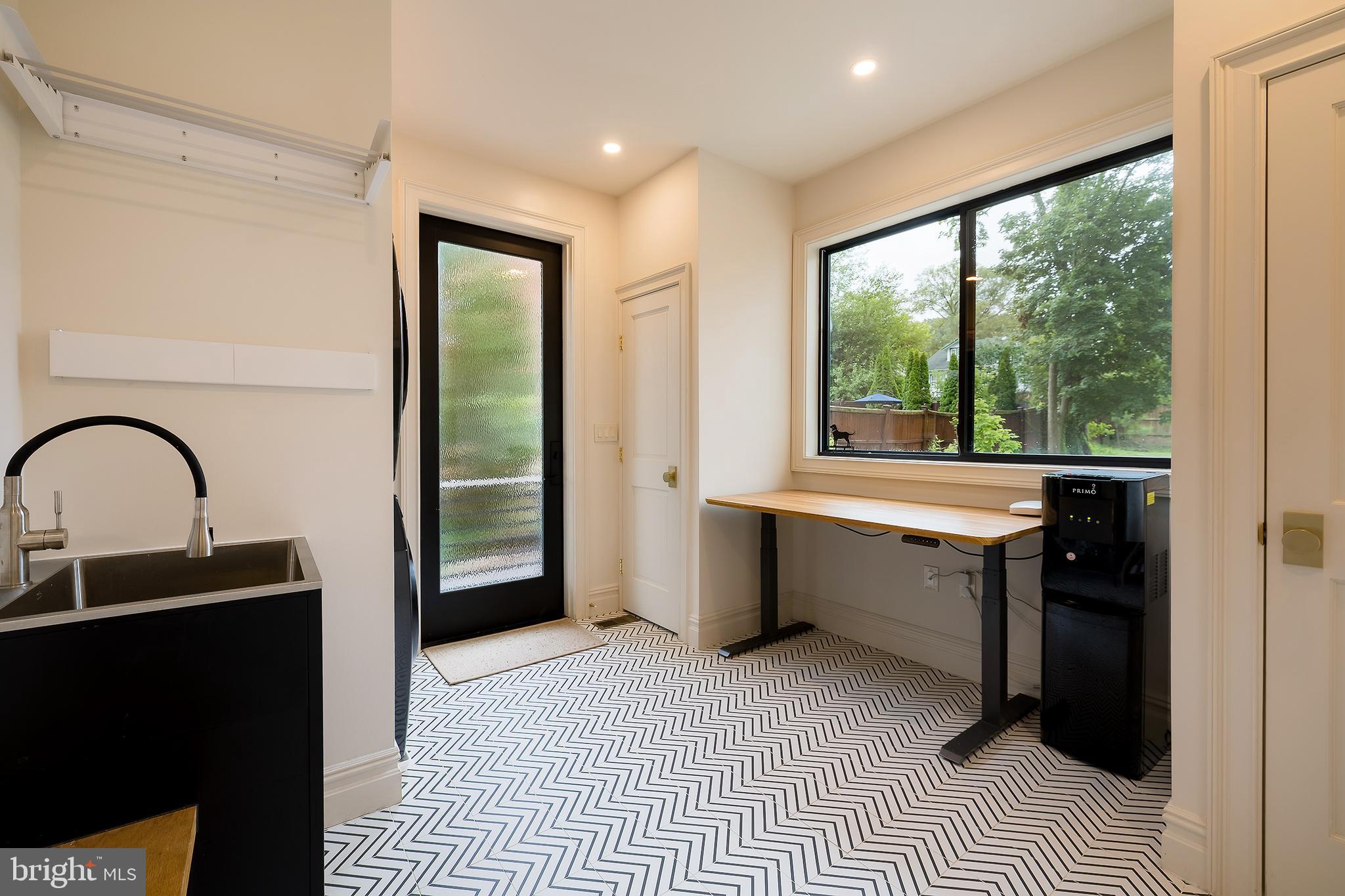 1207 Randolph Street Northeast Washington, DC 20017 - Photo 16 of 47 a view of a large white kitchen with a sink and outdoor space
