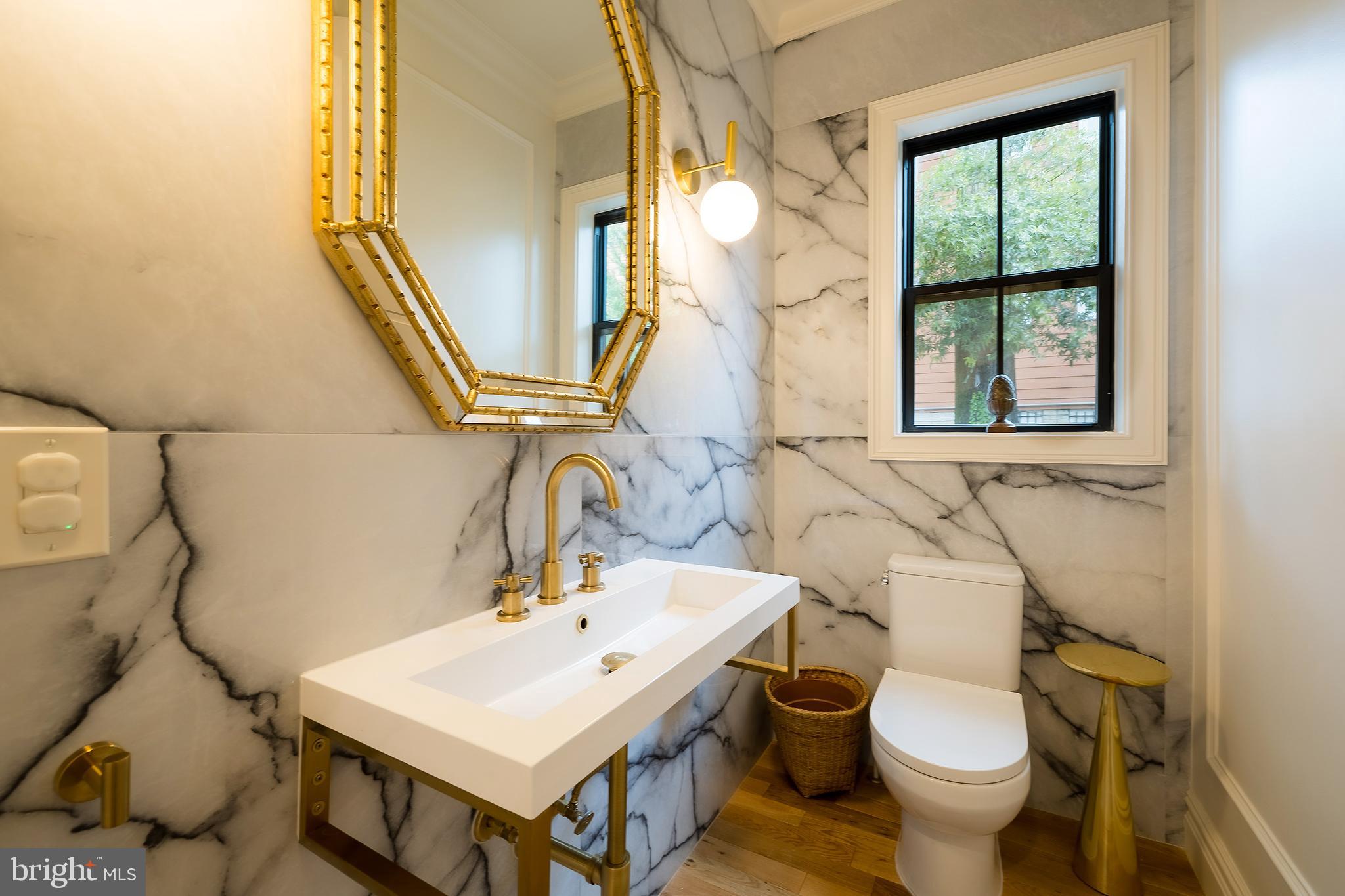 1207 Randolph Street Northeast Washington, DC 20017 - Photo 18 of 47 a bathroom with a sink and a mirror