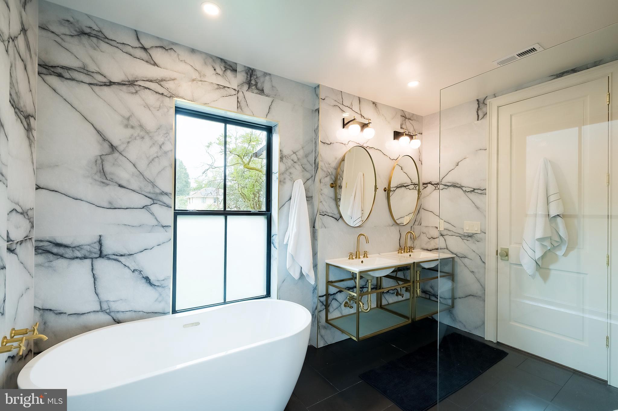 1207 Randolph Street Northeast Washington, DC 20017 - Photo 27 of 47 a bathroom with a sink toilet and a bathtub