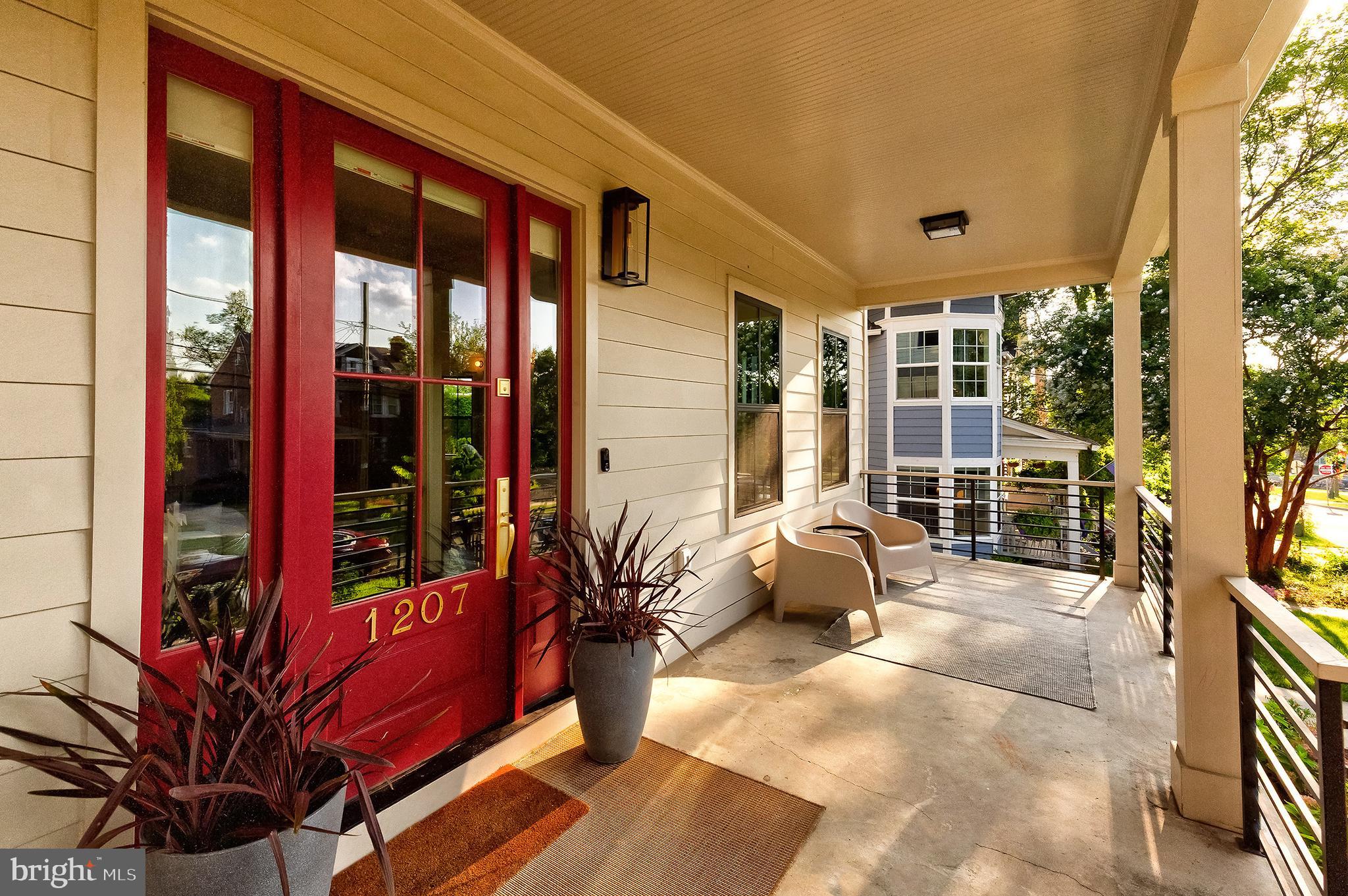 1207 Randolph Street Northeast Washington, DC 20017 - Photo 3 of 47 a building outdoor space with patio furniture and potted plants