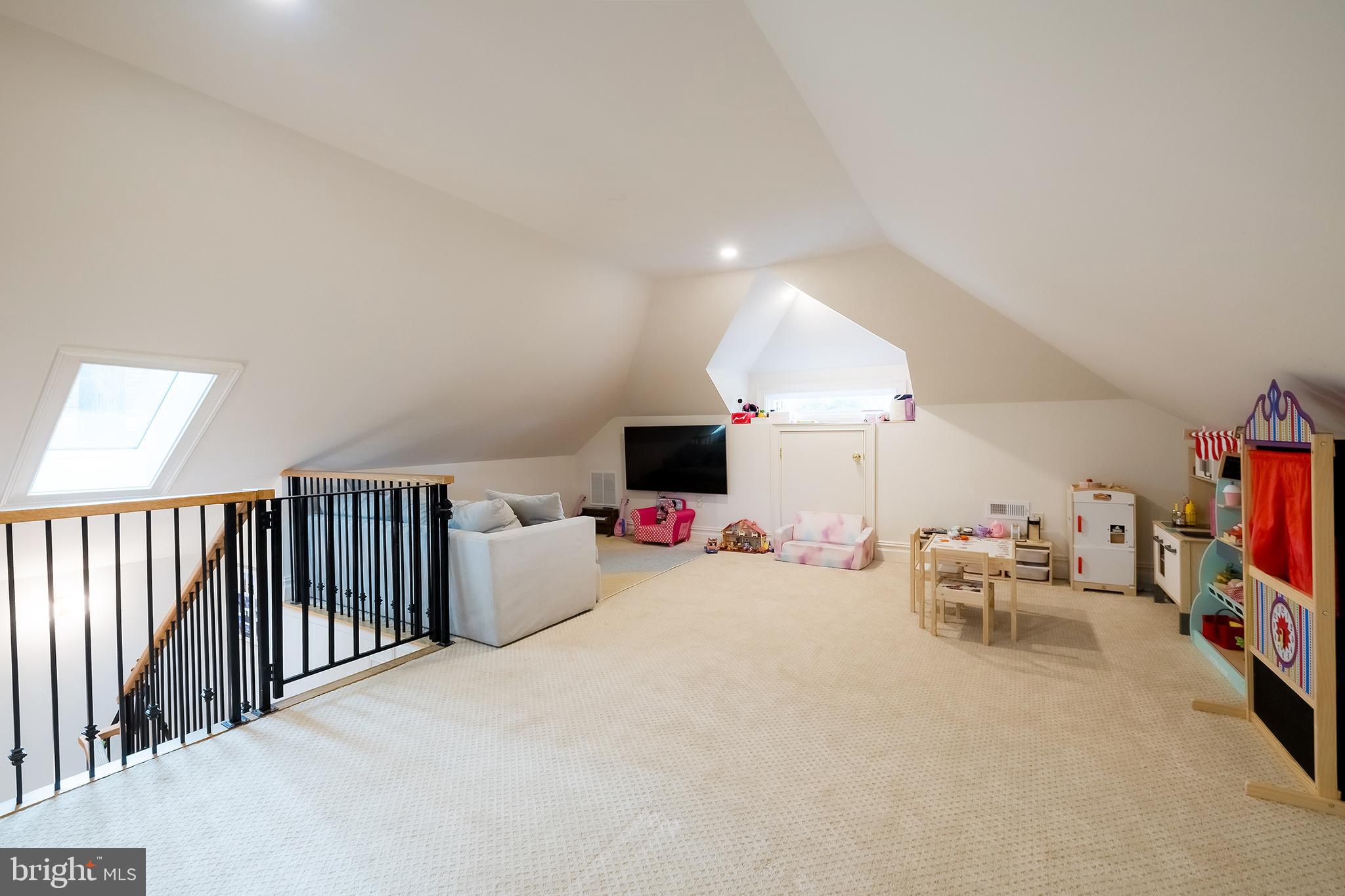 1207 Randolph Street Northeast Washington, DC 20017 - Photo 35 of 47 a living room with furniture and a flat screen tv