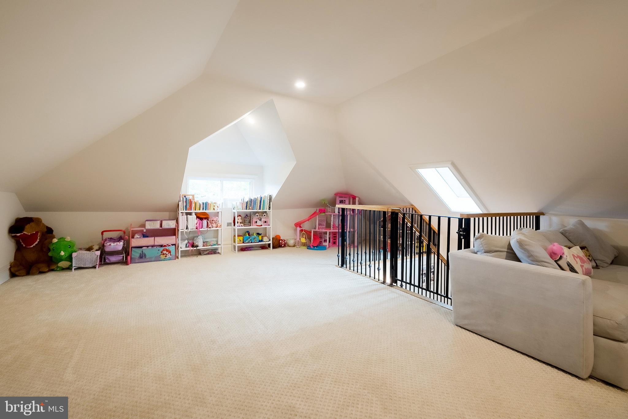 1207 Randolph Street Northeast Washington, DC 20017 - Photo 36 of 47 a living room with lots of furniture and a fan