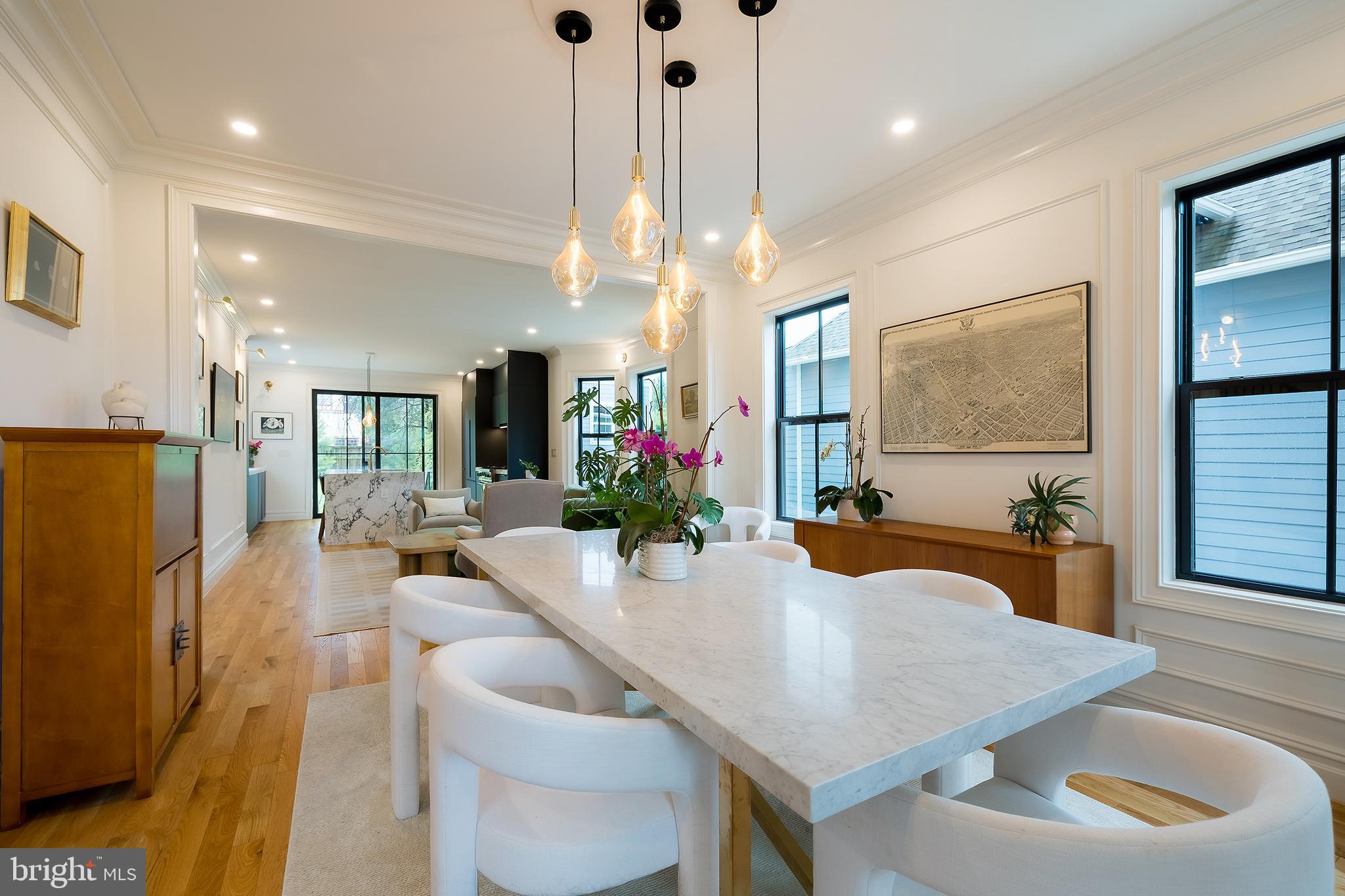 1207 Randolph Street Northeast Washington, DC 20017 - Photo 6 of 47 a view of a dining room with furniture and a chandelier