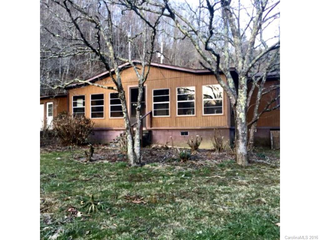 8508 Alarka Road Bryson City, NC 28713 - Photo 1 of 13 a front view of a house with garden