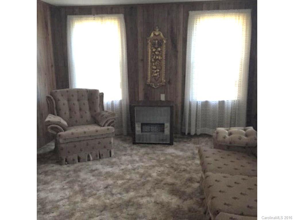 8508 Alarka Road Bryson City, NC 28713 - Photo 4 of 13 a living room with furniture and a fireplace