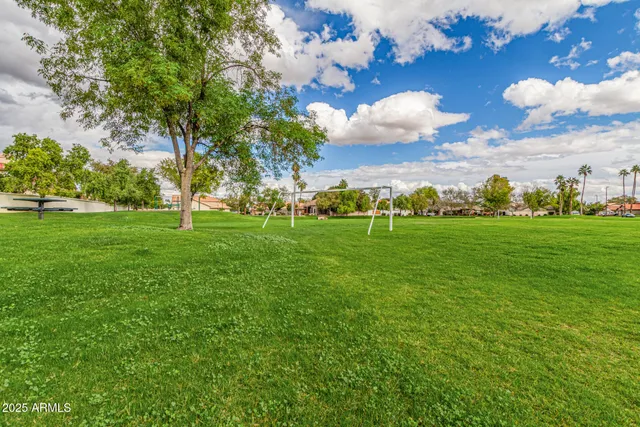 a view of a building and trees in the background