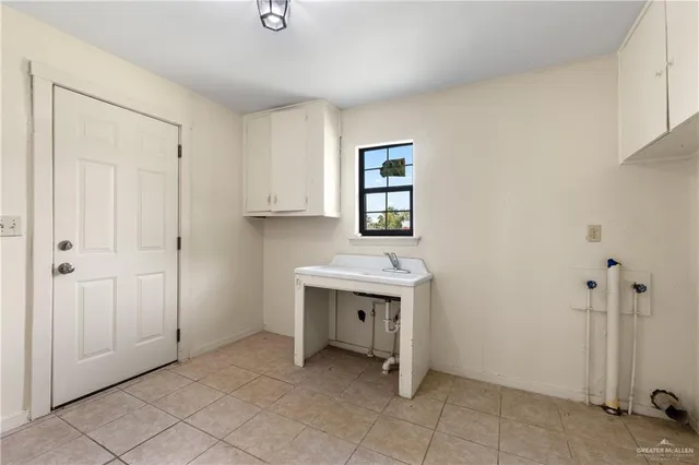 a view of an empty room with a bathroom